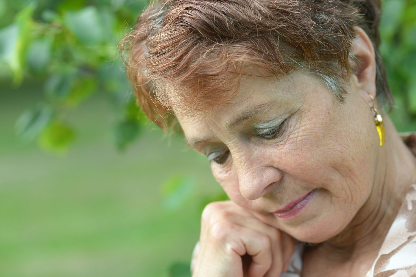 Image of an older woman who is distressed