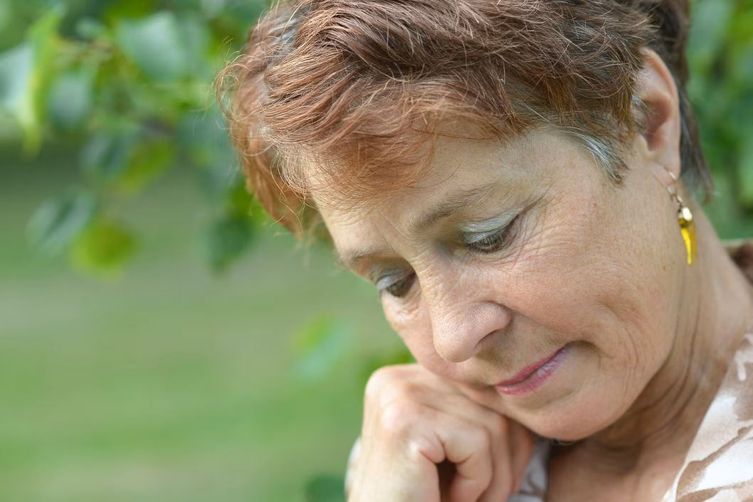 Image of an older woman who is distressed