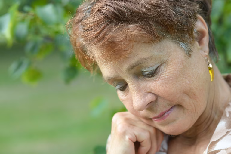 Image of an older woman who is distressed