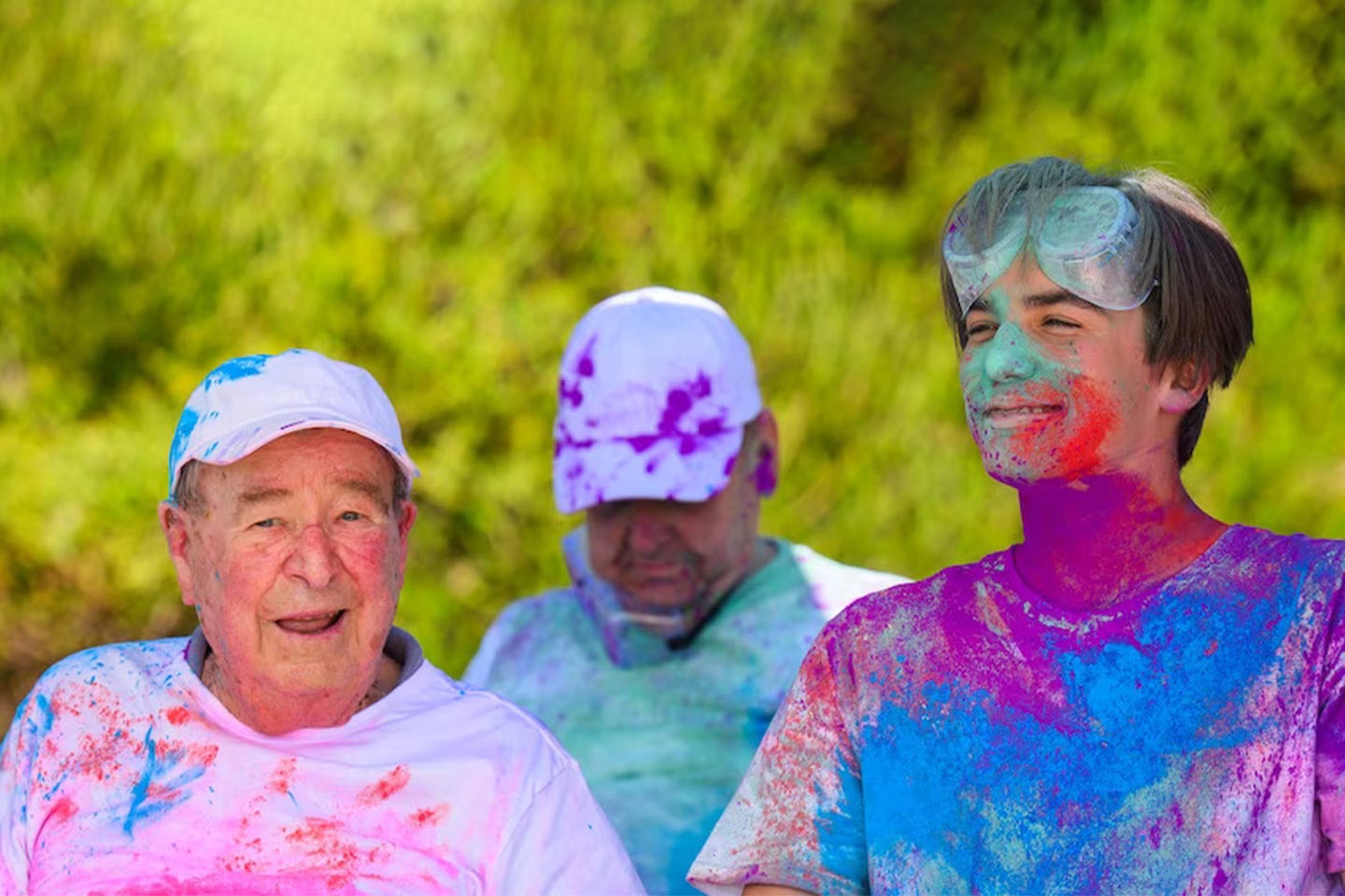 Photo of three men enjoying a colour run
