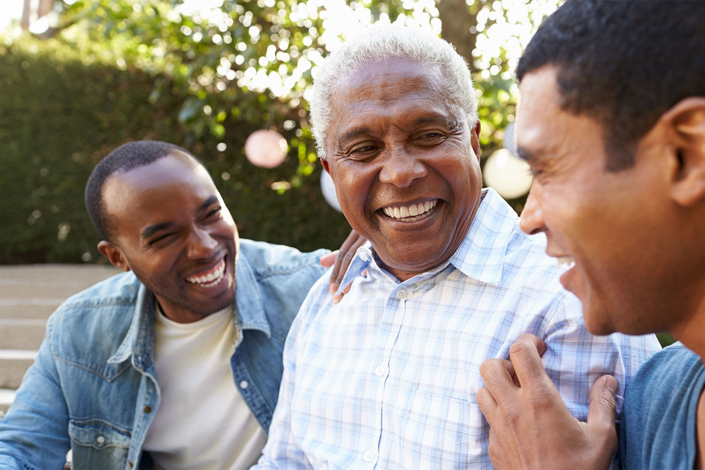 Image of an older black man and his two sons