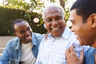 Image of an older black man and his two sons