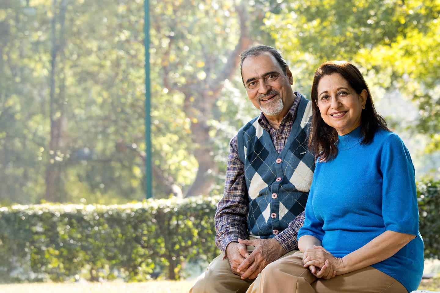 Image of a man and a woman sitting outside
