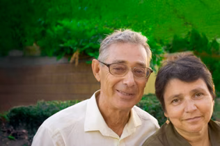 Image of a man and woman in their front yard
