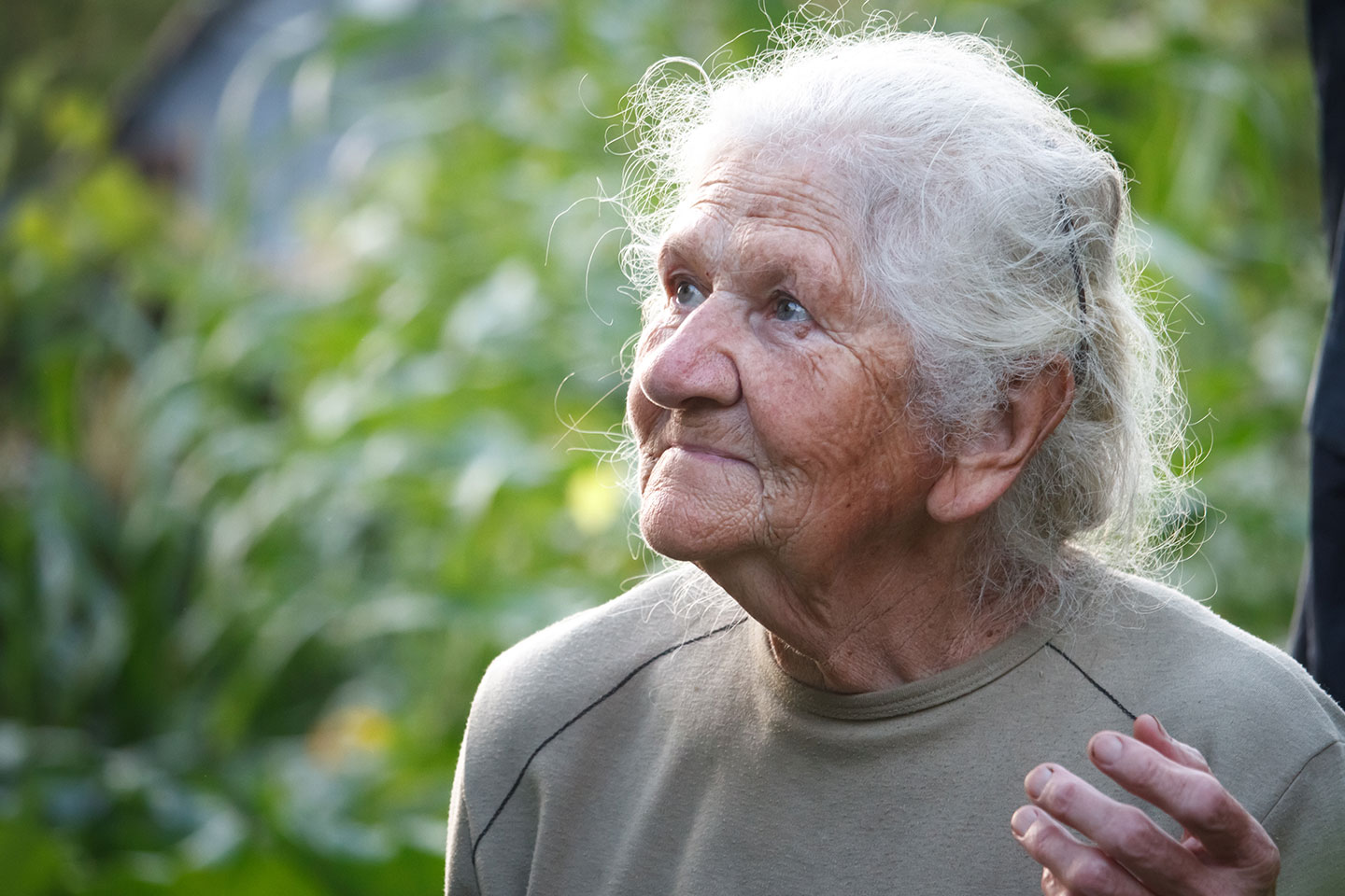 Photo of an elderly lady in a garden