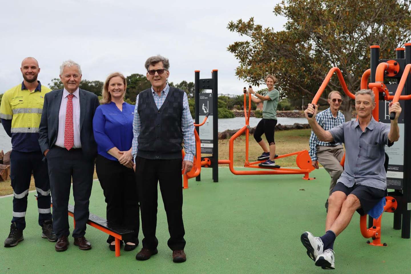 Photo of a group of people at an outdoor fitness area