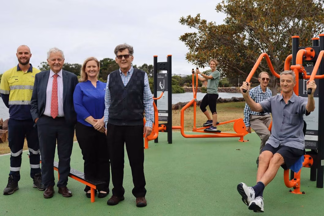 Photo of a group of people at an outdoor fitness area