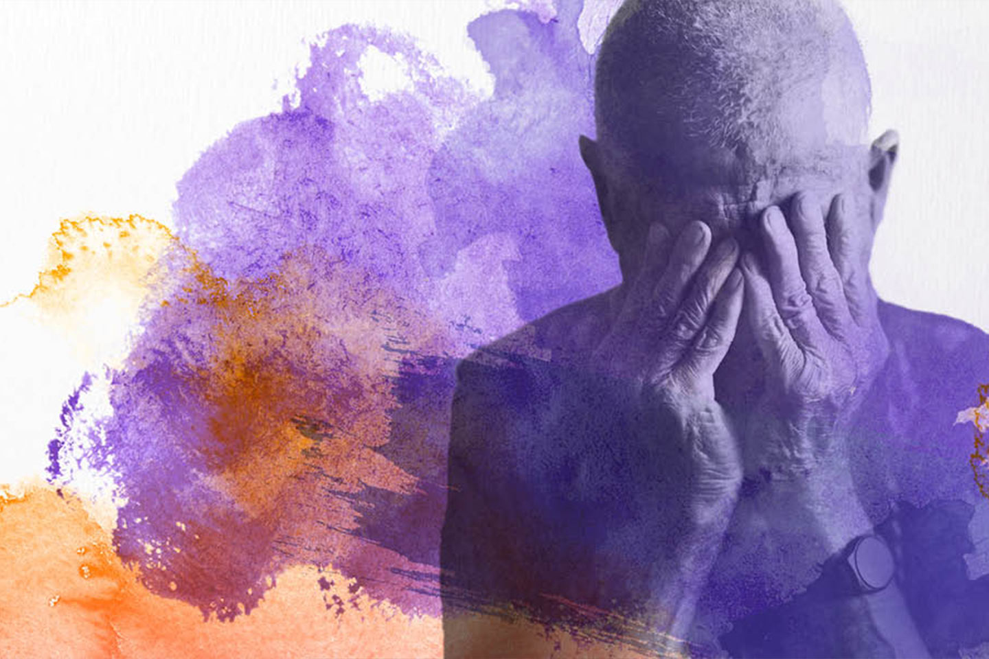 Photo of a man with his hands over his eyes