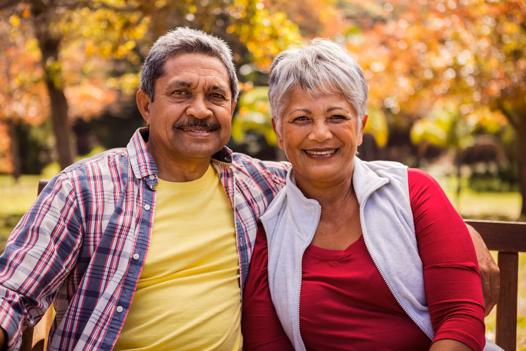 Senior couple sitting on a park bench
