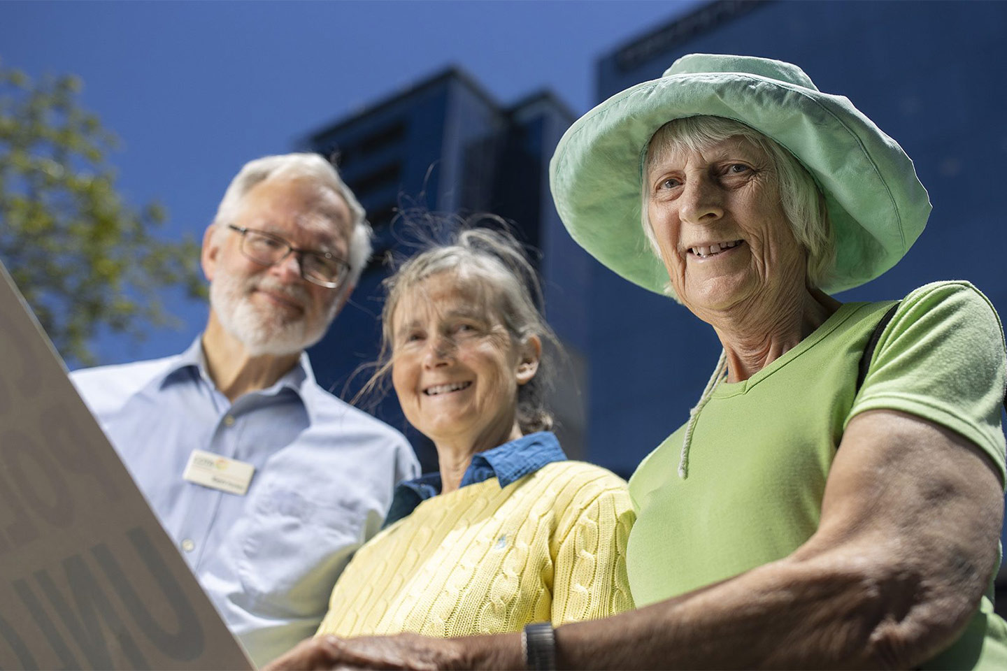 Photo of three people smiling