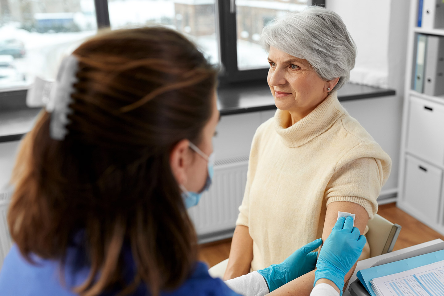 Photo of a woman about to receive a vaccine