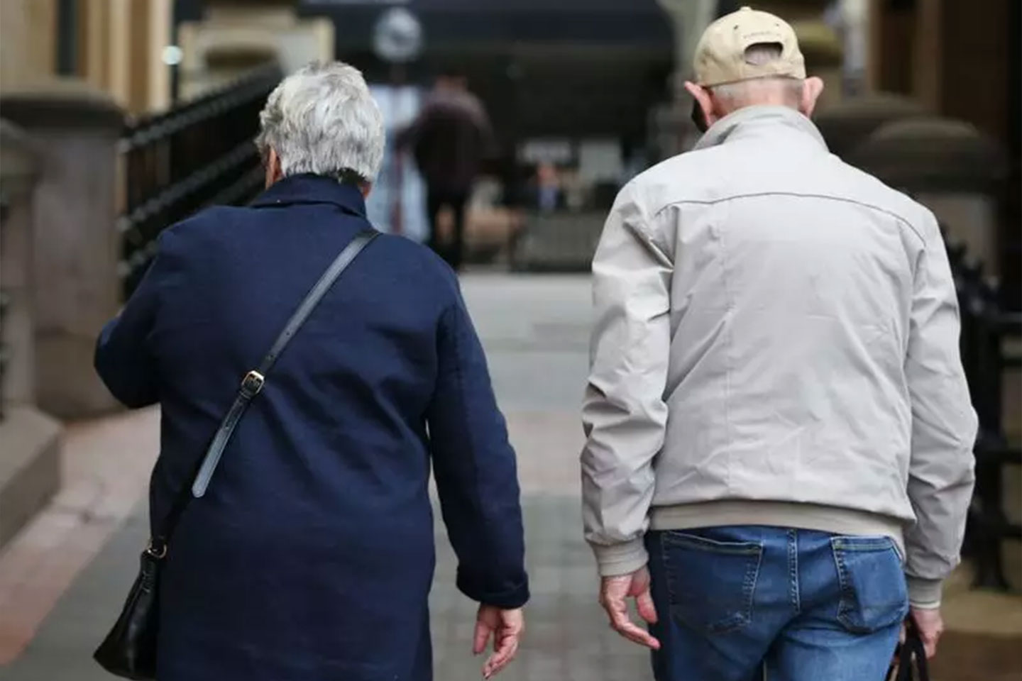 Photo of a couple walking together in a street