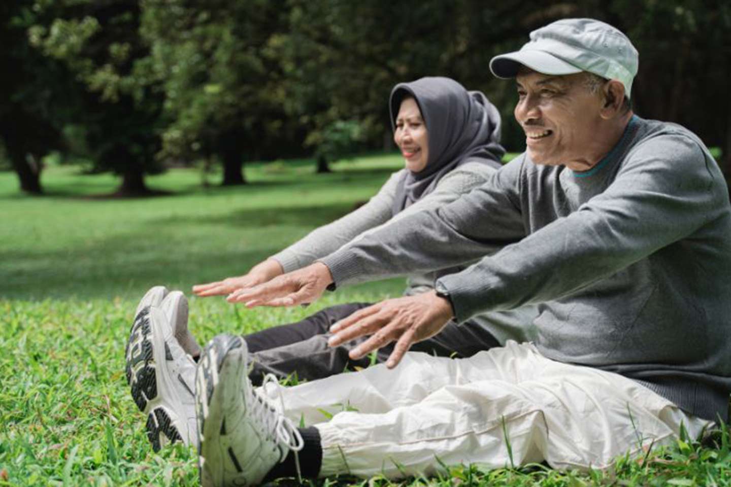 Photo of Muslim couple exercising outdoors