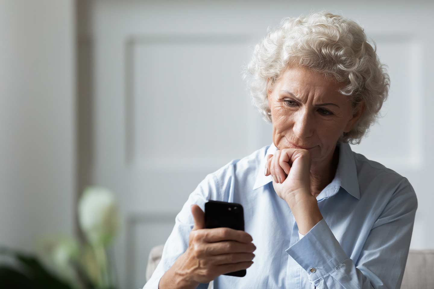 Photo of a woman looking at her phone