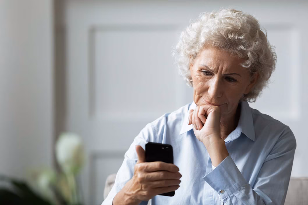 Photo of a woman looking at her phone