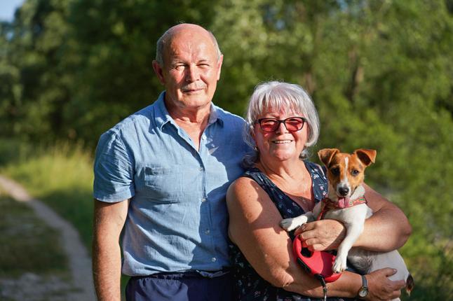 Middle aged couple and their dog