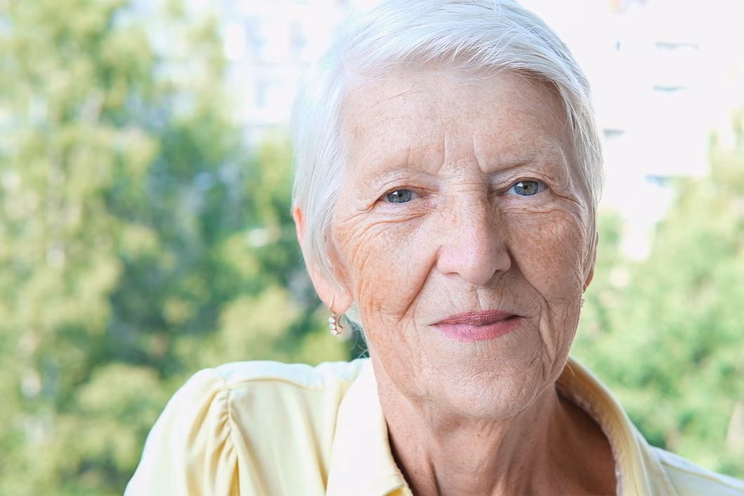 Image of an older caucasian woman with short grey hair