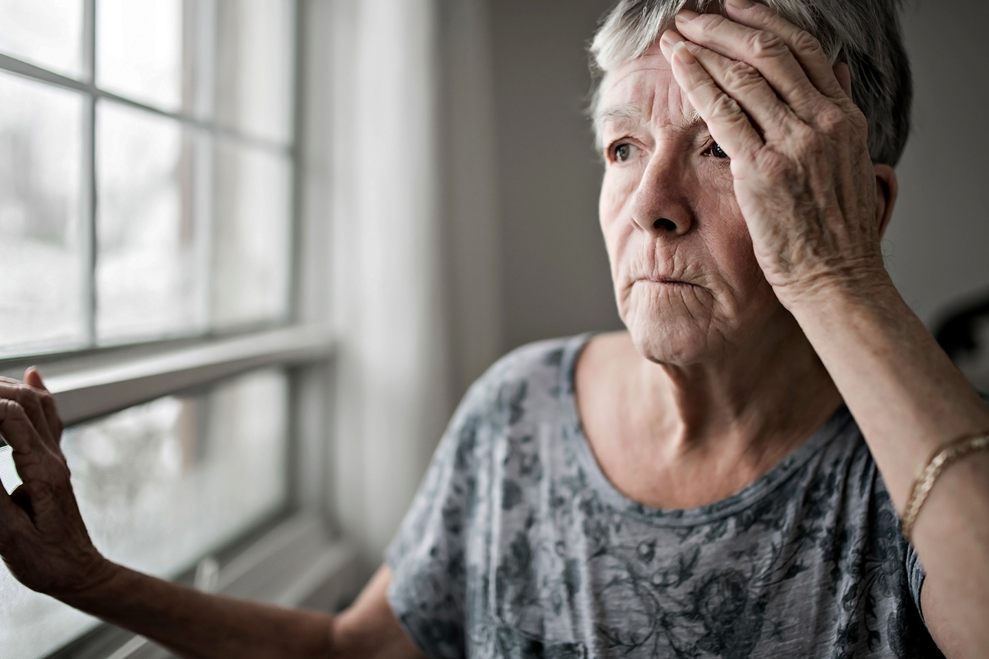 Photo of woman with her hand to her head
