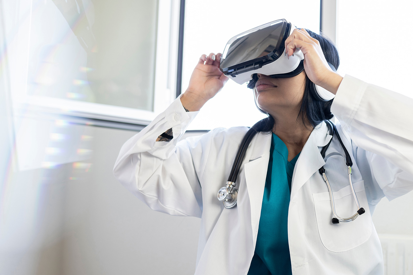 Photo of health professional testing VR goggles