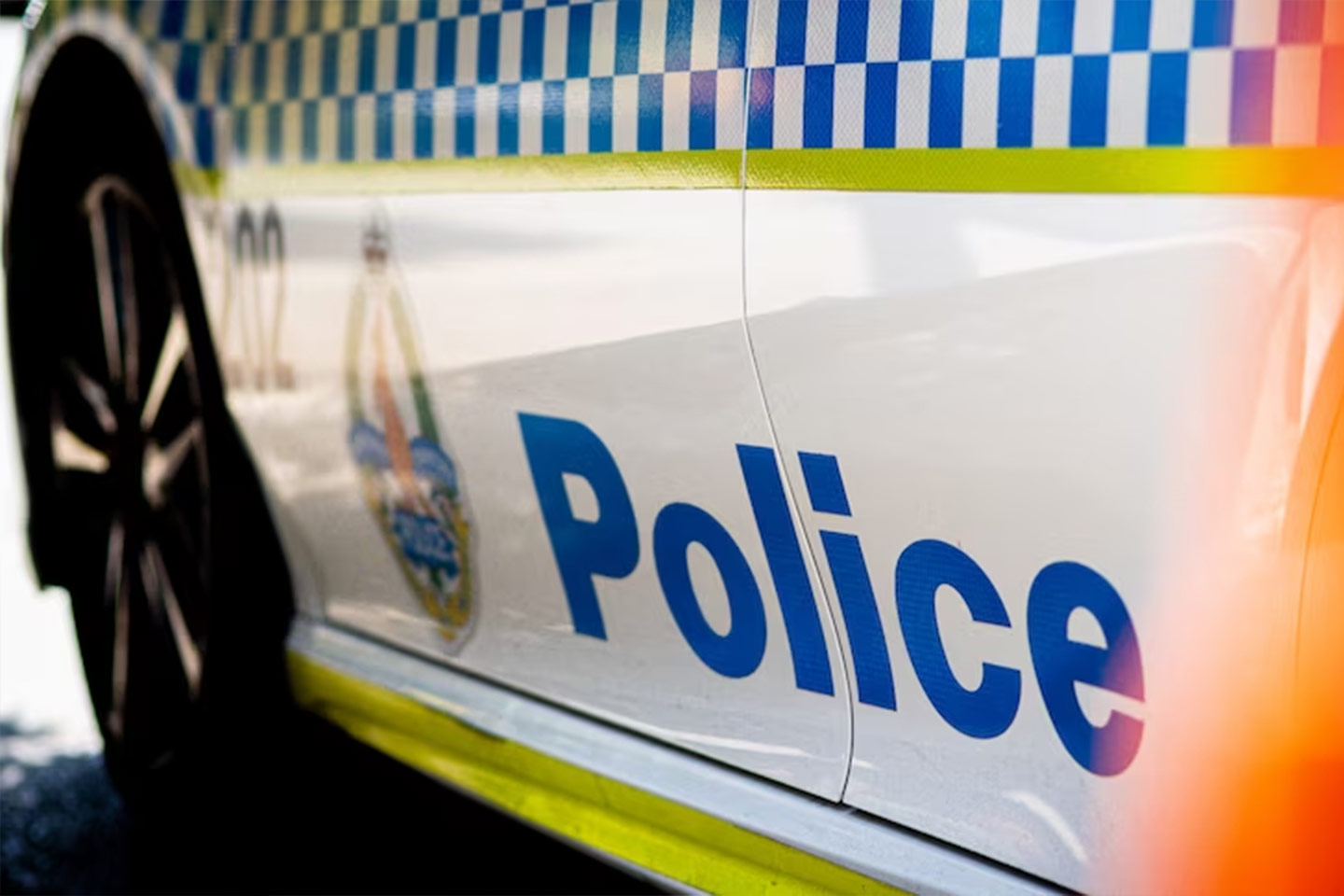 Photo of a closeup of the side of a police car