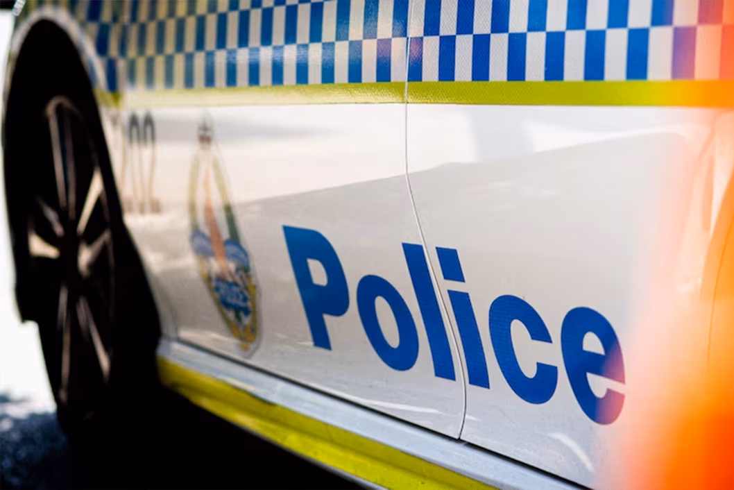 Photo of a closeup of the side of a police car