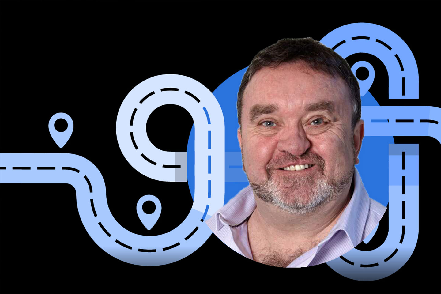 Photo of a smiling man with a beard