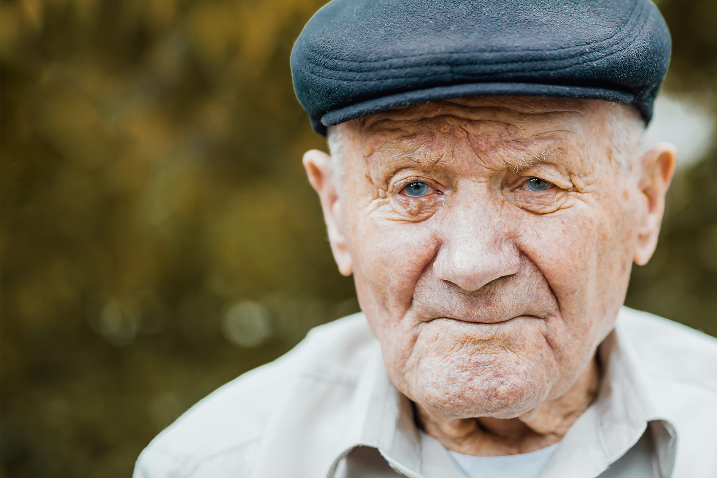 Photo of a senior gent in a cloth cap