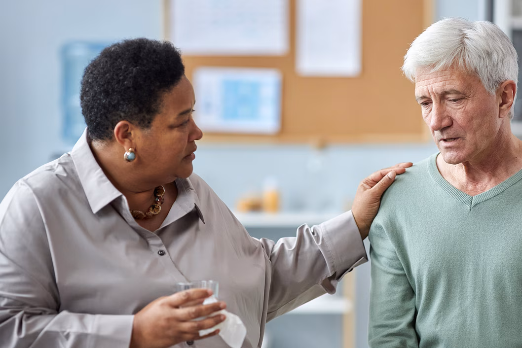Photo of woman comforting man