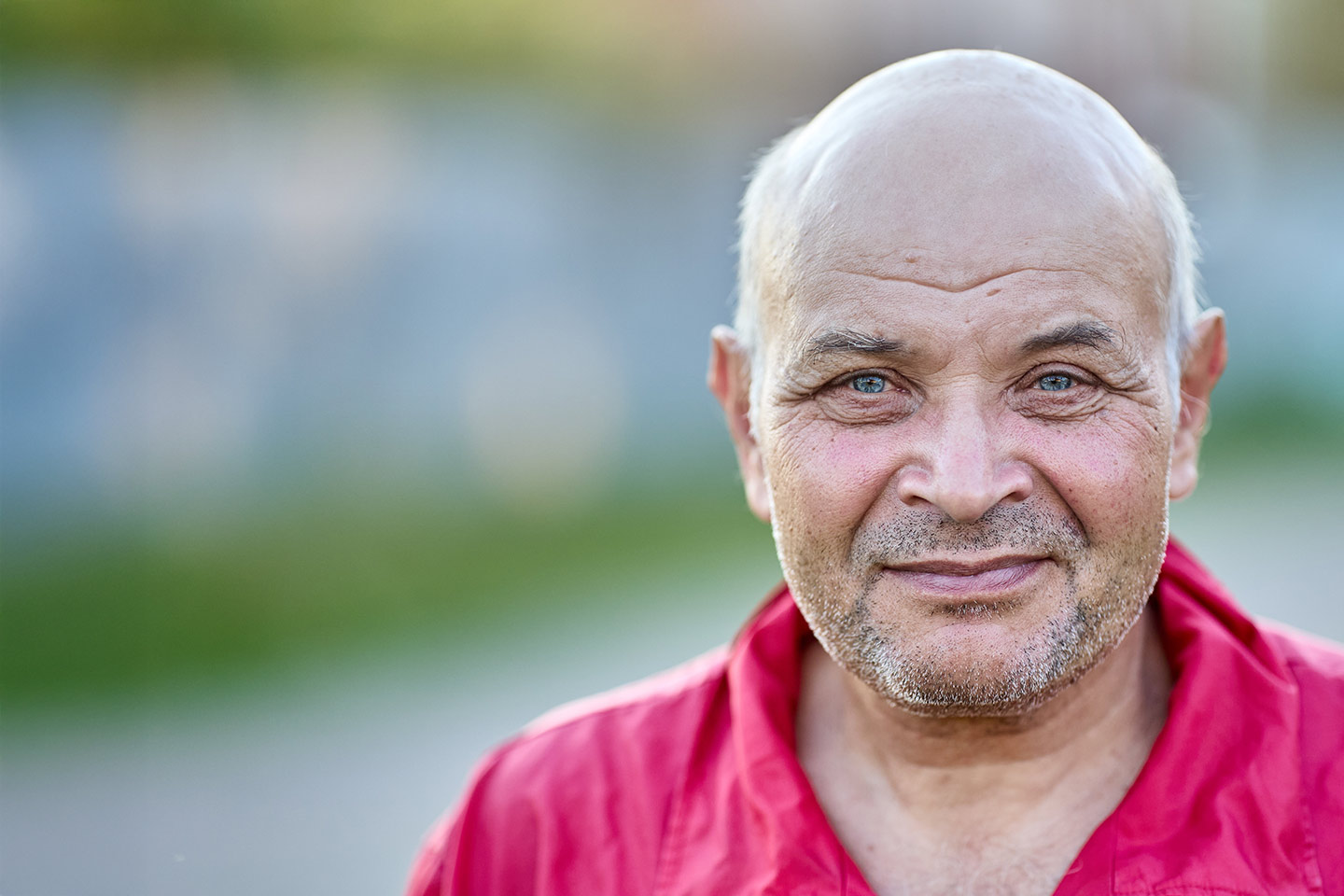 Photo of a man wearing a red shirt