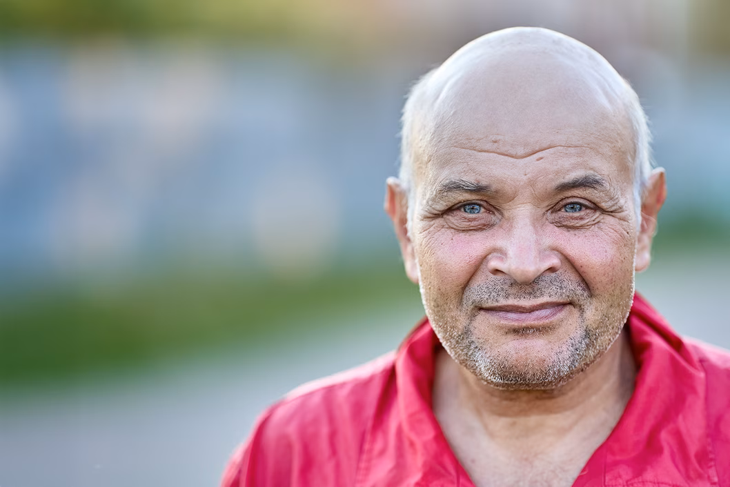 Photo of a man wearing a red shirt