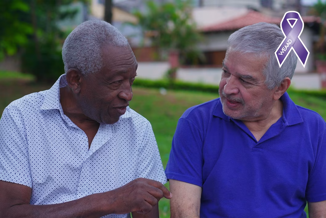 Photo of two men chatting outdoors