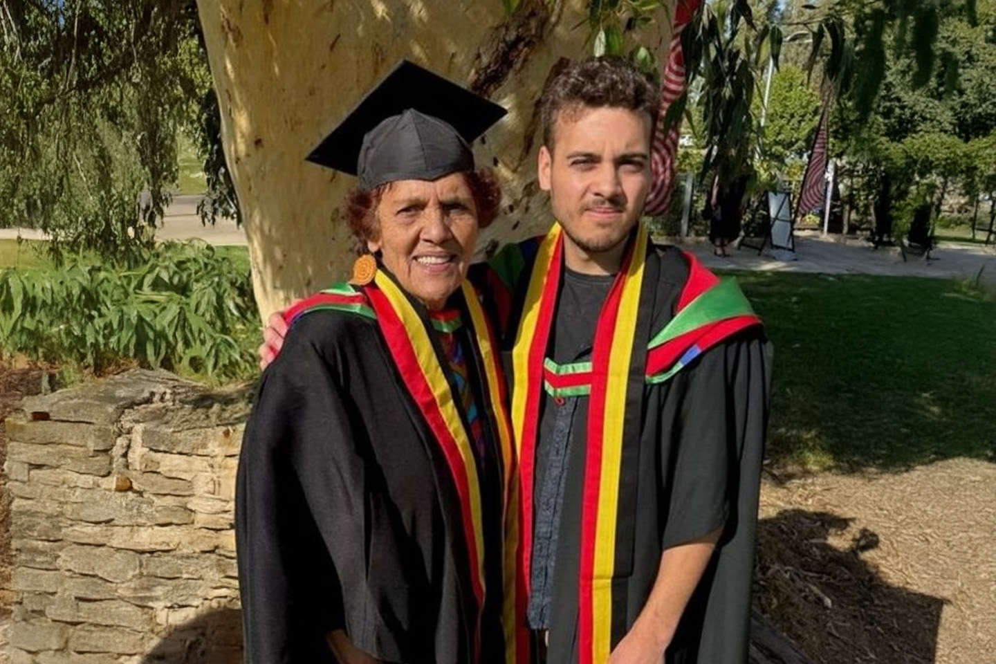 Image of a A grandmother and grandson have graduated together from Charles Sturt University after supporting each other through a course in Wiradjuri language, culture and heritage.