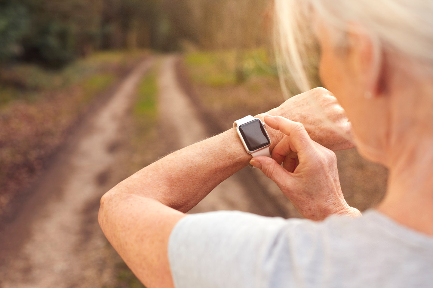 Image of an older woman wearing a smart watch