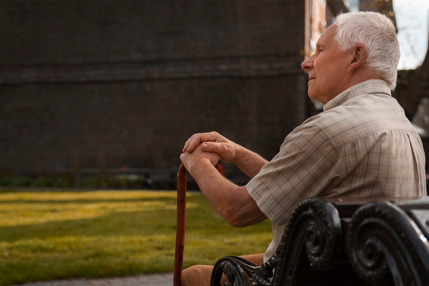 Photo of a man sitting on a park bench