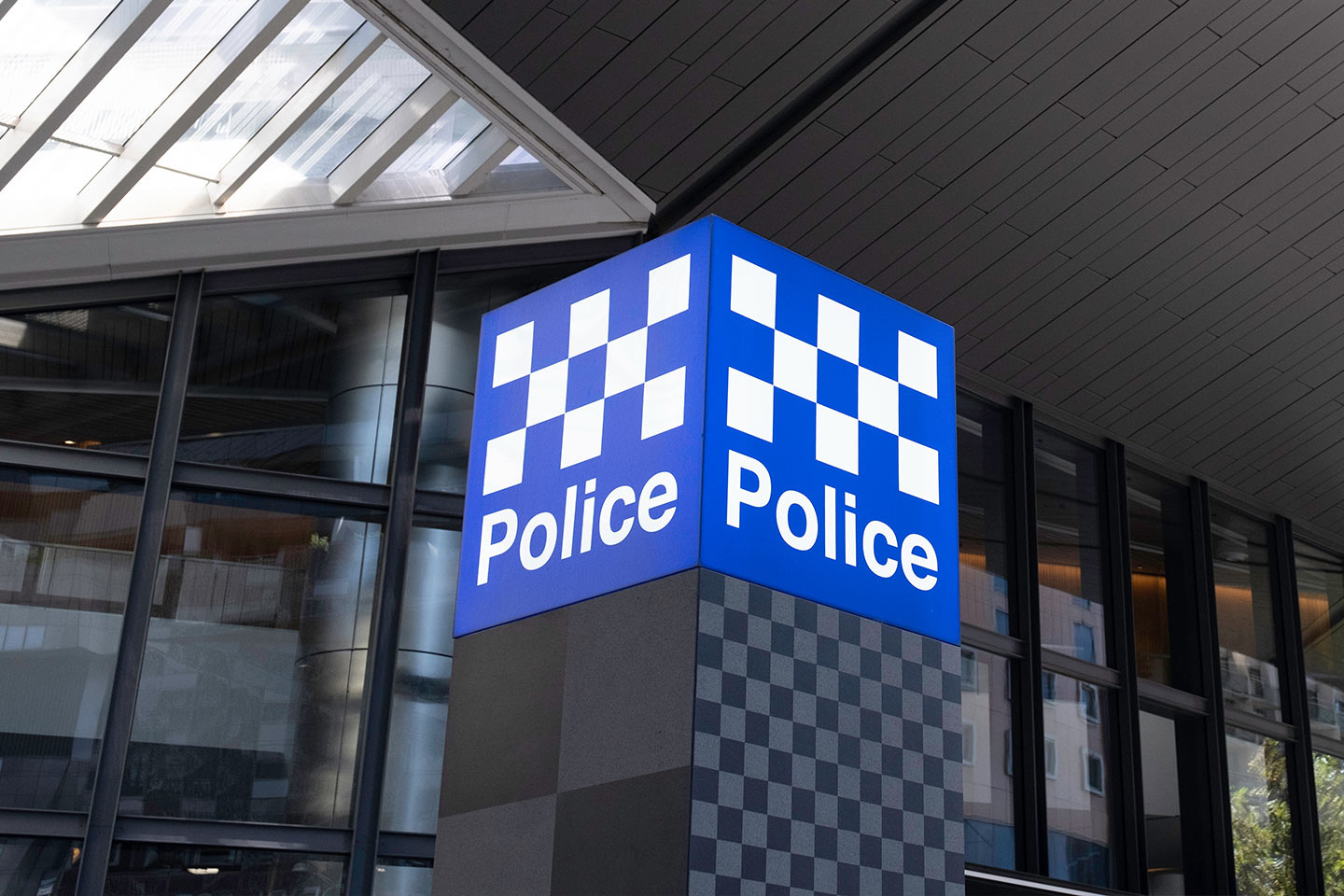 Photo of blue and white chequered police sign