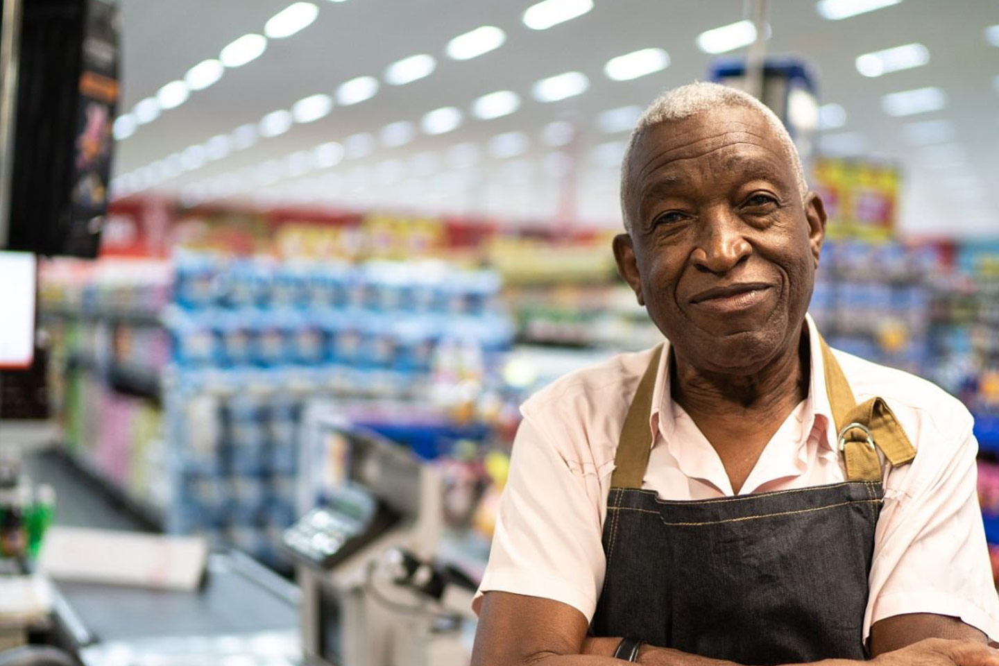 Photo of an older man working in a modern store