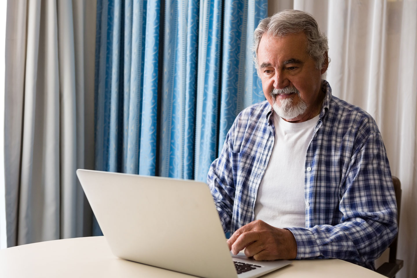 Senior man using a laptop 