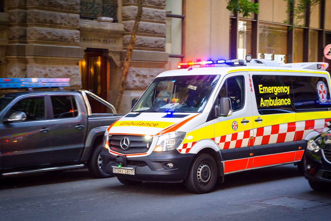 Photo of an ambulance in a city street