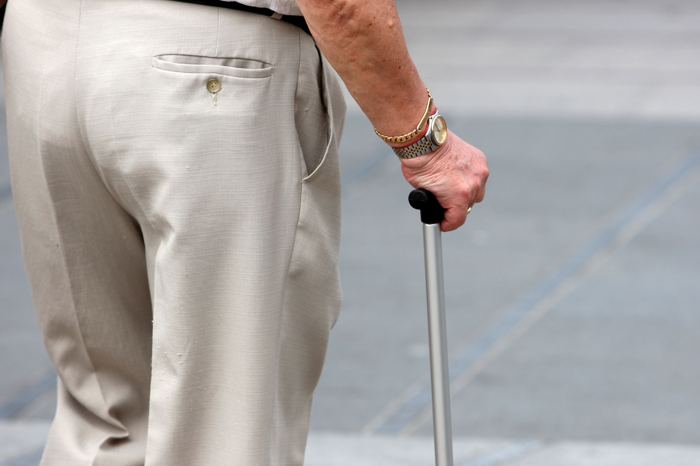 Senior man walking with a cane