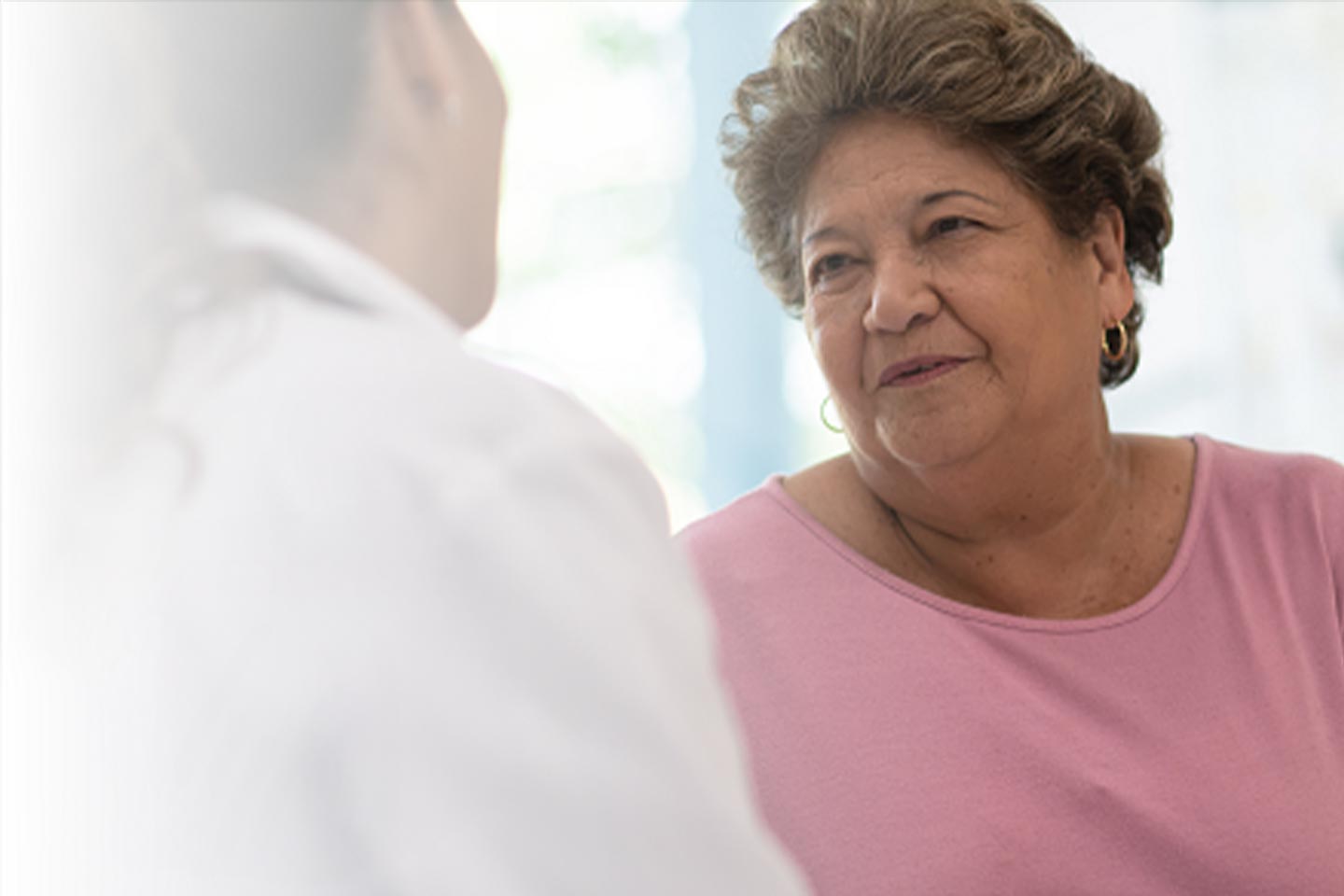 Photo of two women chatting with each other