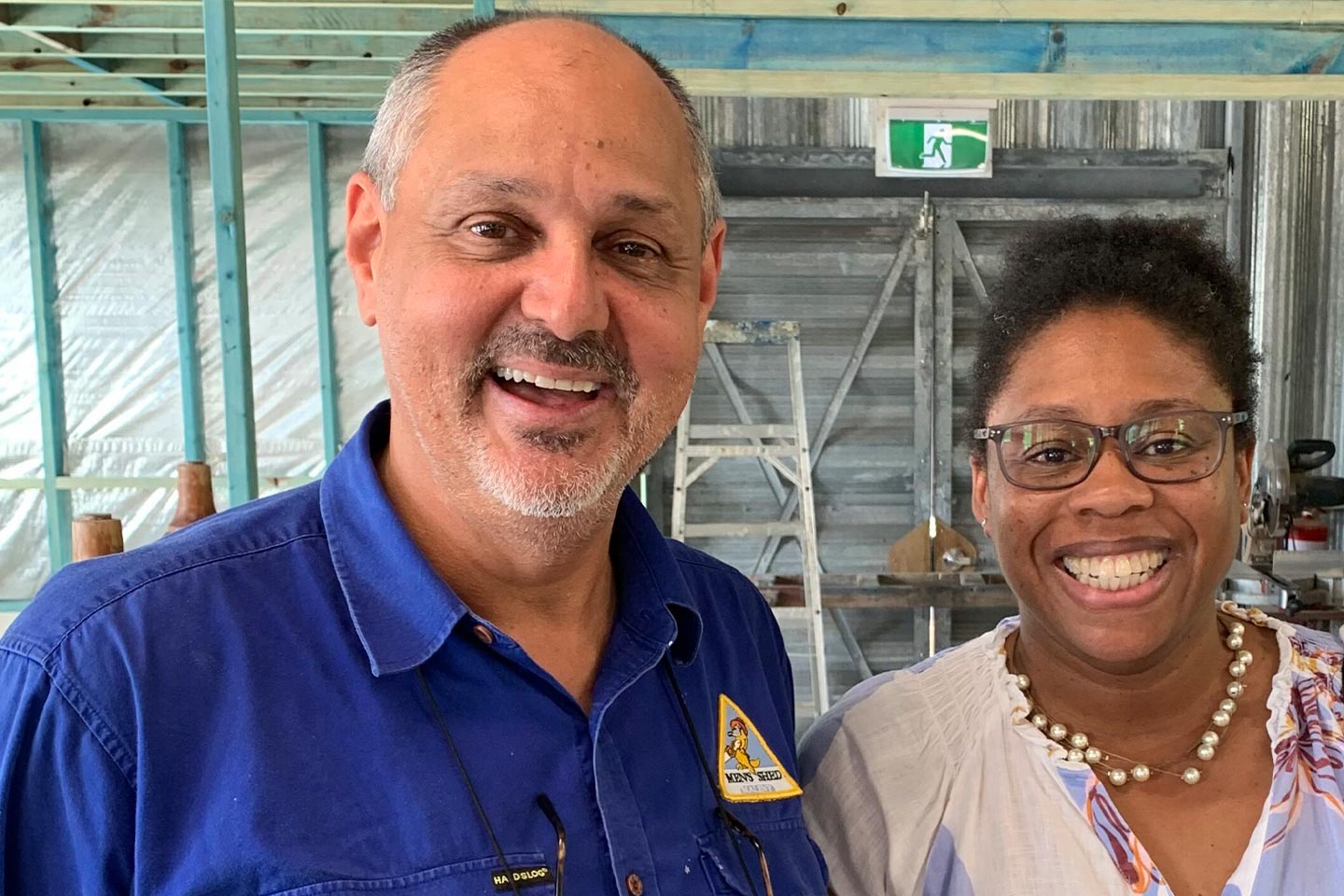 Photo of a man and woman smiling broadly at us