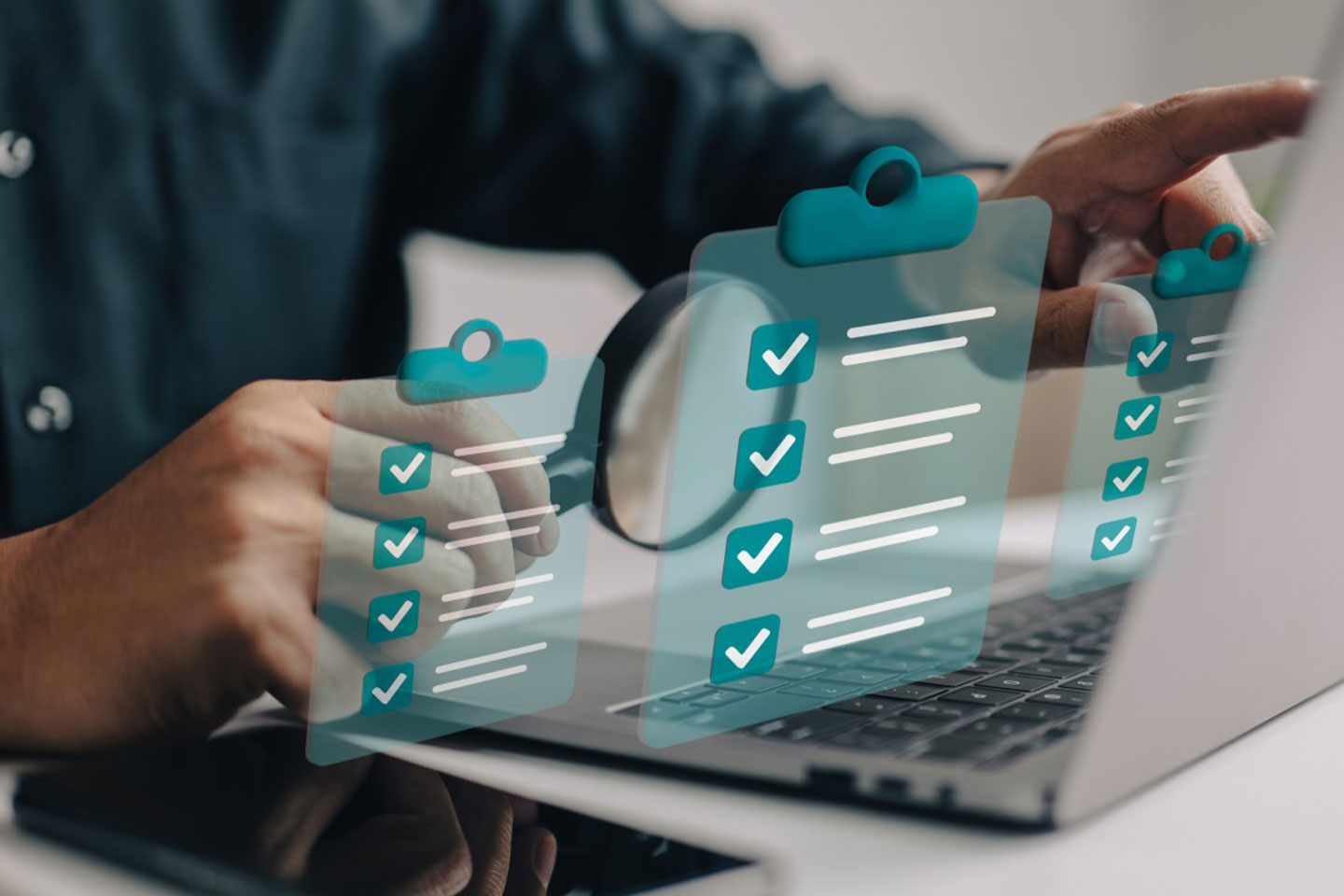 Photo of hands and laptop with graphic checklists