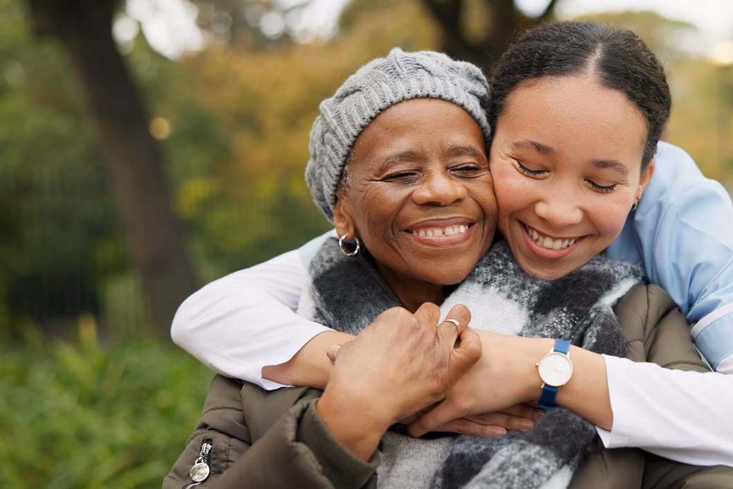 Photo of a woman embracing the shoulders of another woman
