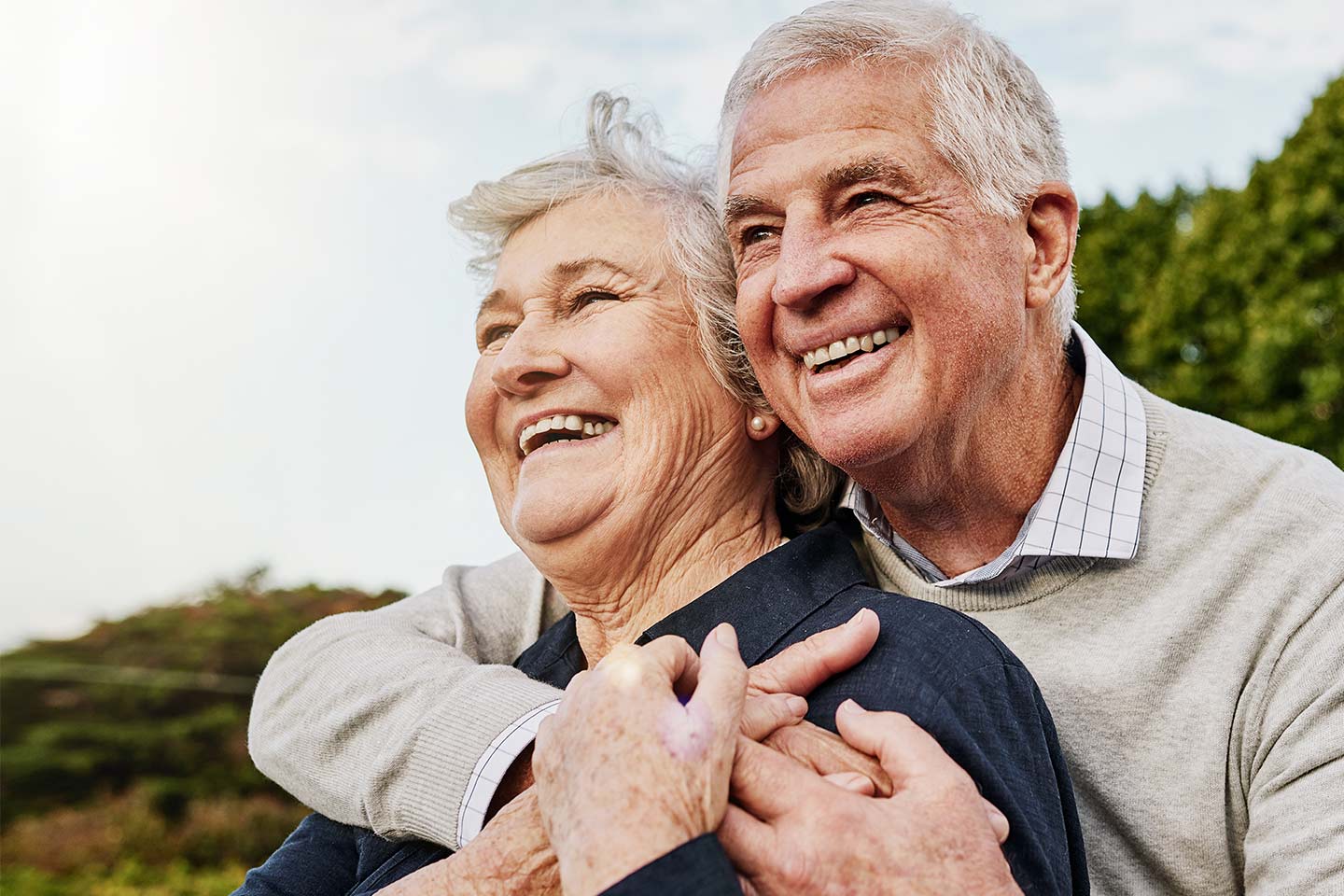 Photo of a happy mature couple embracing outdoors