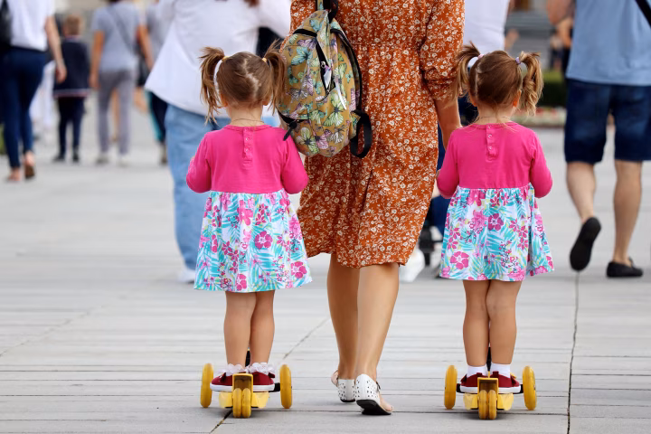 Twins girls with their grandmother 