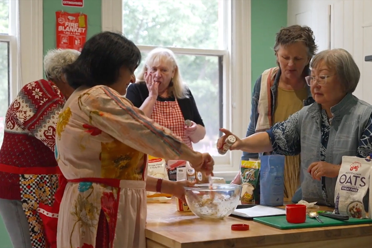 Photo of women in a kitchen baking together