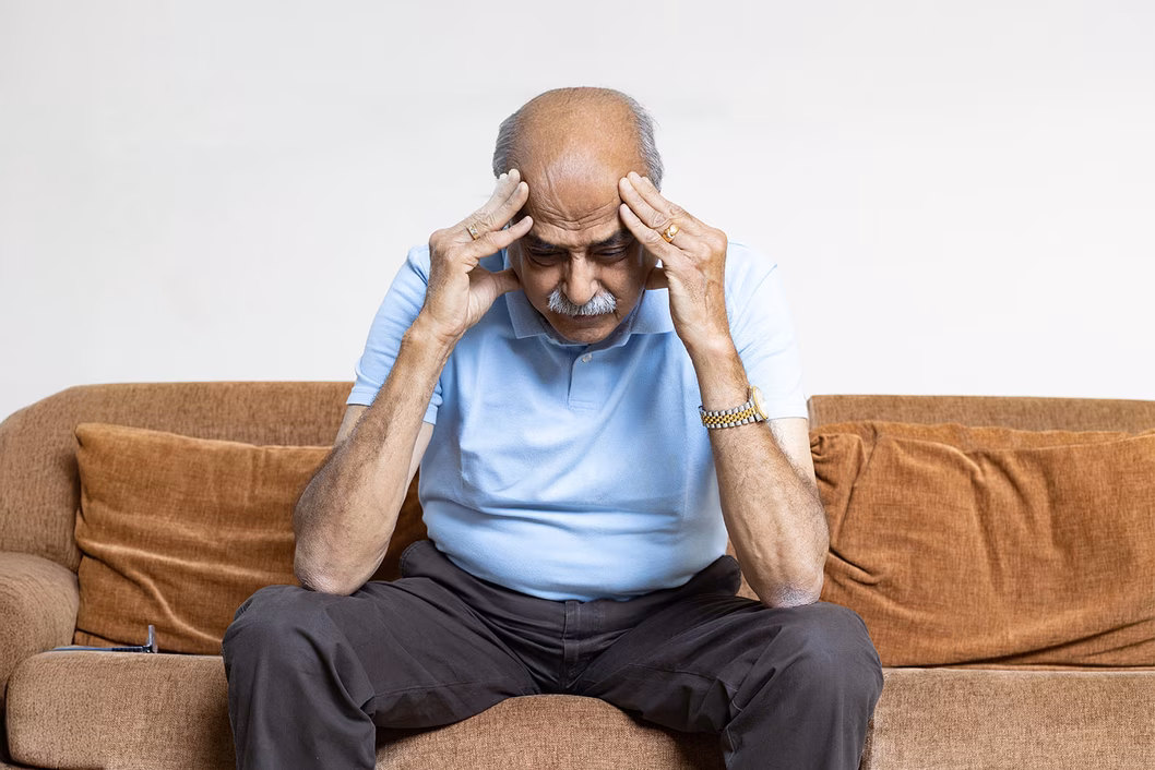 Image of an older man in distress.