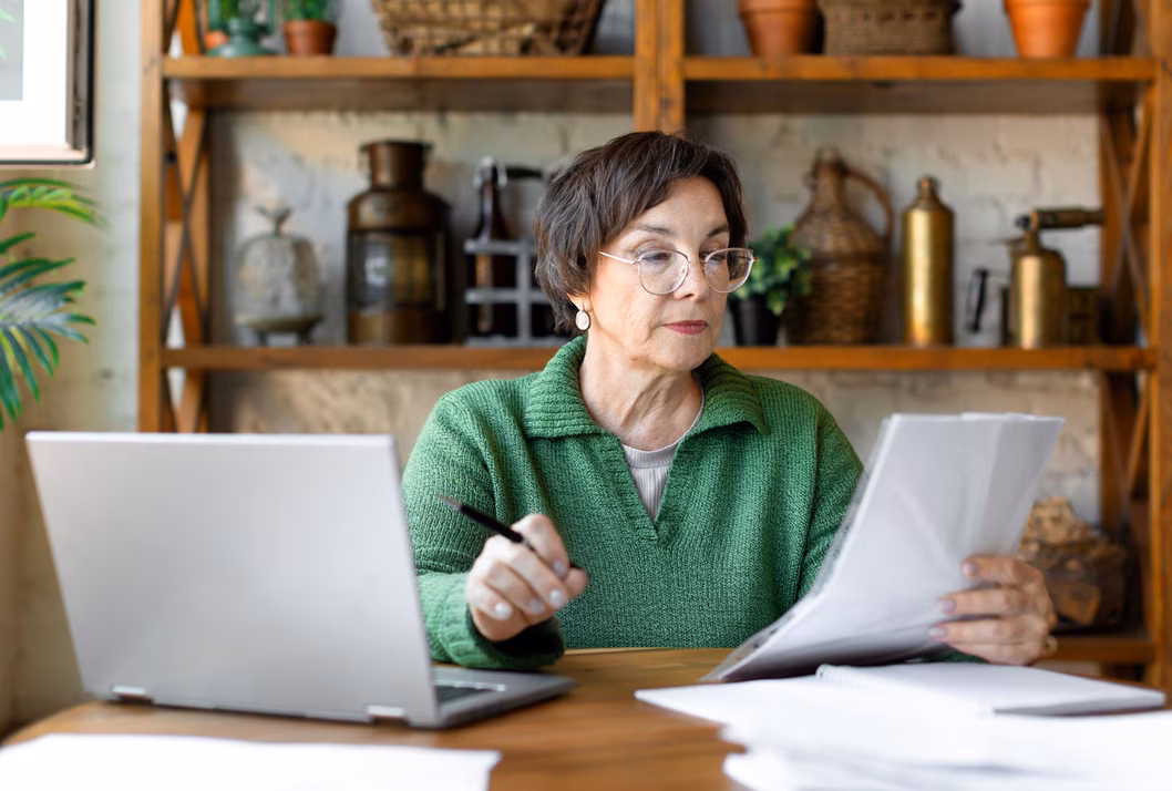 Older woman filling out forms