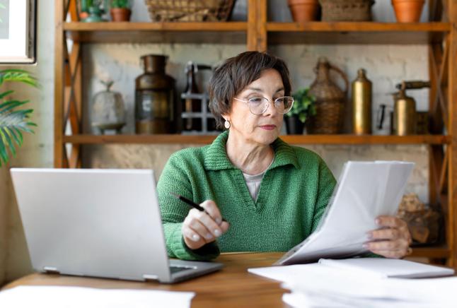 Older woman filling out forms