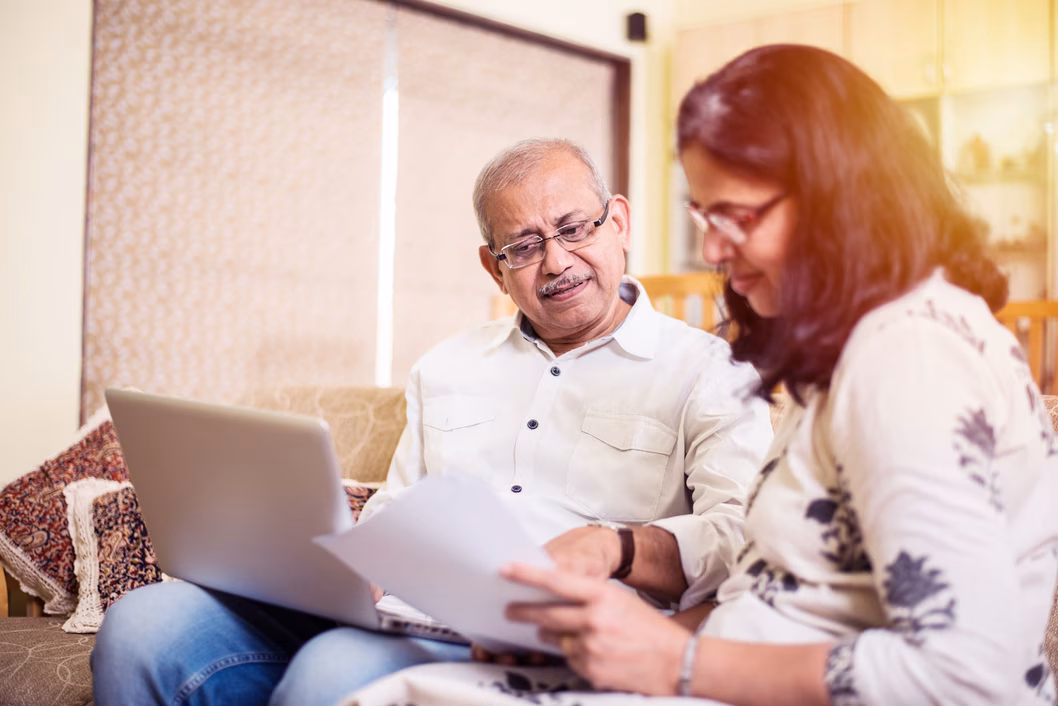 Senior couple looking over documents